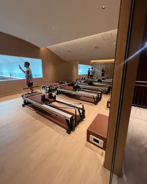 Reformer pilates studio overlooking the courts