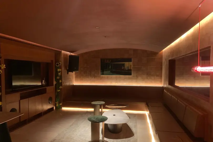 VIP lounge with built-in sofa and warm lighting